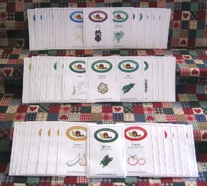 Large Family Heirloom Seeds Collection – wide variety of heirloom vegetable and fruit seed packets neatly displayed.