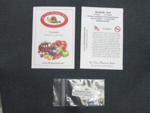 Labeled heirloom garden seeds with planting instructions and sealed packet for safe storage